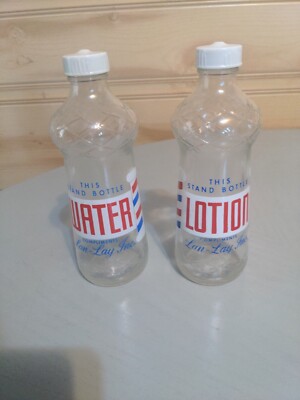 2 DURAGLASS THIS STAND BOTTLES WATER & LOTION COMPLIMENTS LAN-LAY INC.  