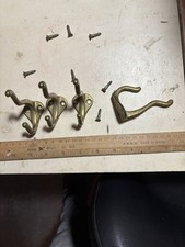 Four solid brass coat hangers