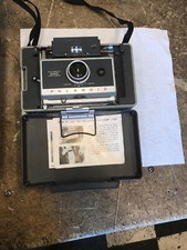 VINTAGE POLAROID 340 CAMERA KIT. HAS FLASH ATTACHMENT , BULBS,FILM, CASE