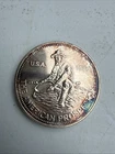 1986 1 TROY OZ 999.0 FINE SILVER ROUND ENGELHARD AMERICAN PROSPECTOR