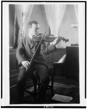 8" x 10" Photo Bronislaw Huberman, full-length portrait, seated, facing right,