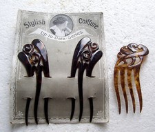 Early 20th century celluloid hair combs on original card