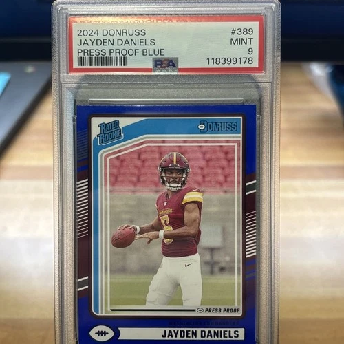 2024 Panini Donruss #389 JAYDEN DANIELS Rated Rookie Blue Press Proof PSA9