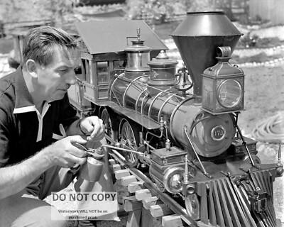 WALT DISNEY WORKING ON HIS MODEL RAILROAD TRAIN 8X10 PHOTO (DA