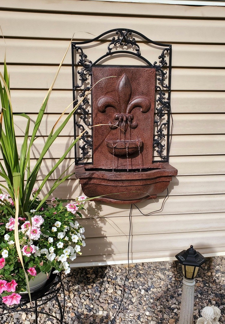French Lily Polystone Outdoor Solar Wall Fountain - Iron by Sunnydaze