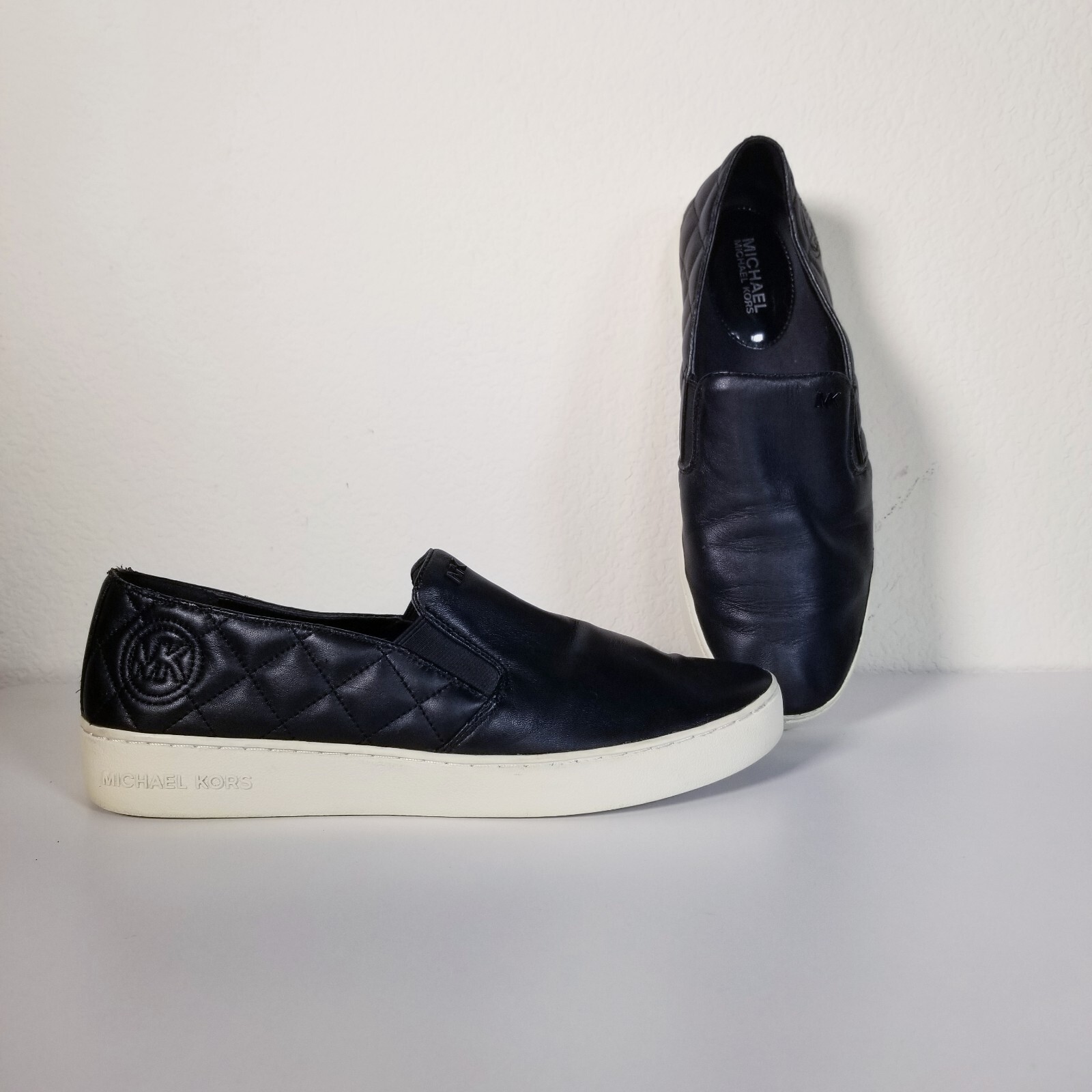 black leather quilted sneakers