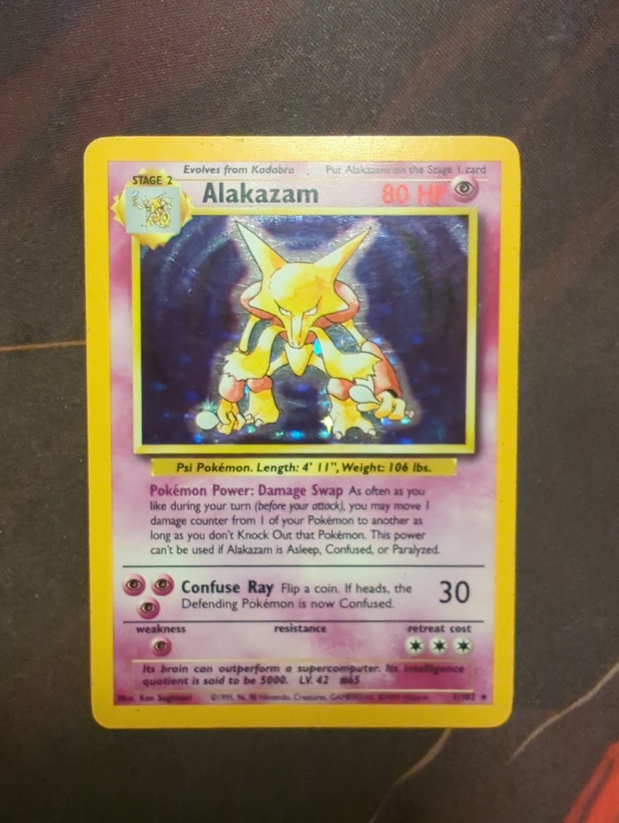 1999 Pokémon Base Set Alakazam Holo Rare #1/102 Unlimited