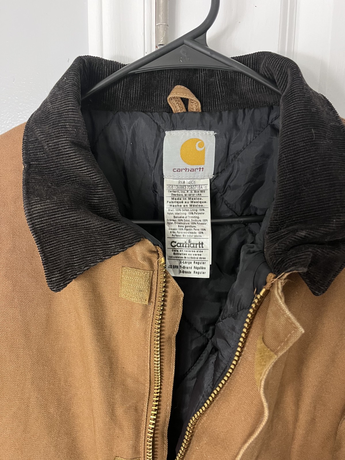 Brown Carhartt Detroit jacket with visible blanket lining at the collar