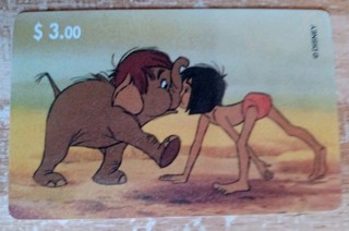 Disney PhonecardJungle book. YOUNG BOY WITH A BABY ELEPHANT. IN GOOD CONDITION.