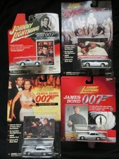 Set of 4 007 Bond cars Aston Martin DB5 x 3 + 2000GT Open Mie Hama Blister