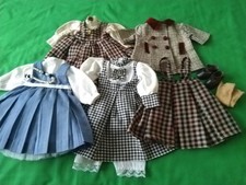 Bundle of Vintage porcelain  Dolls clothes. Pre-owned, in good condition.