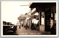 MAIN ST  WELLS Nevada Blatz Greyhound Bus Depot Becker's Best Sign RPPC D11