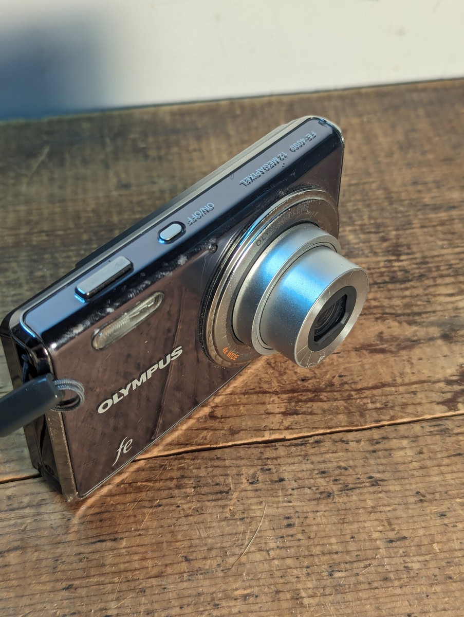 Olympus FE 4000 12 MP Digital Camera w/ battery charger but no