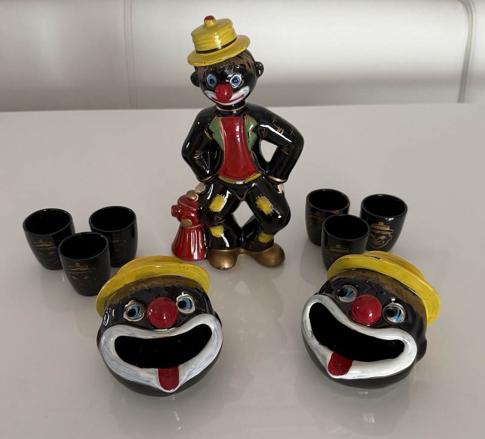 A full kitschy MCM clown/hobo barware set from Japan — decanter, shot glasses, and ashtrays — the pinnacle of mid-century 'what were they thinking' charm.