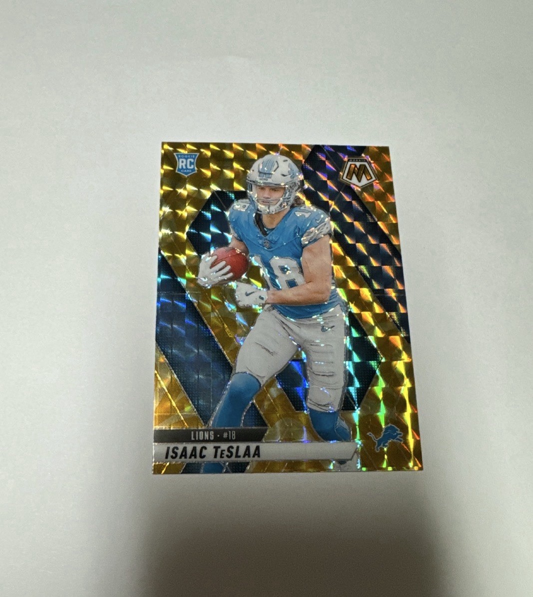 2025 Panini Mosaic Isaac Teslaa Rookie Yellow Reactive Prizm #319 (RC)