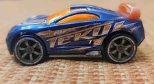 HOT WHEELS AcceleRacers Drift Tech Teku Series Blue W/ Orange Wing Diecast 2005