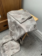 Grey eyelet curtains 90x90. Grey background with metallic  copper leaf pattern.