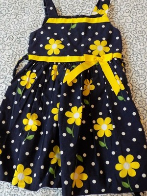 navy dress with yellow flowers