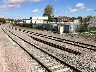Photo 6x4 View from a Didcot-Worcester train - Yard next to the railway l c2017