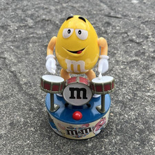 M&M Yellow Character Drummer Battery-Operated Toy/Figure on Blue Base