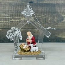 Kneeling Santa Baby Jesus Lamb Star Manger Nativity Christmas Ornament