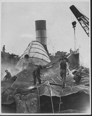 The funnels of the ship Mauretania are torn down as the she is scr- Old Photo
