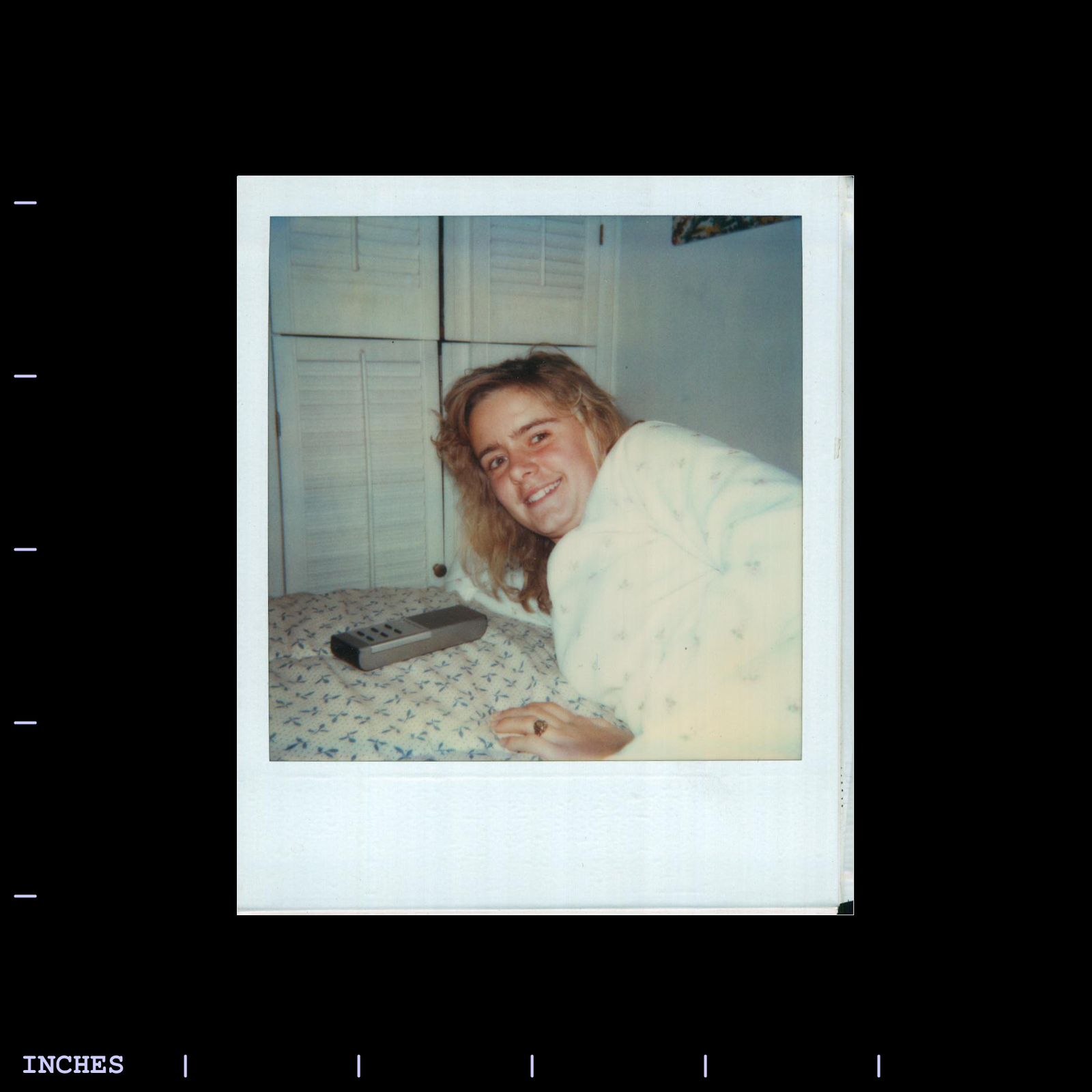 Old Polaroid Photo CLOSE-UP OF WOMAN WITH TV REMOTE CONTROL