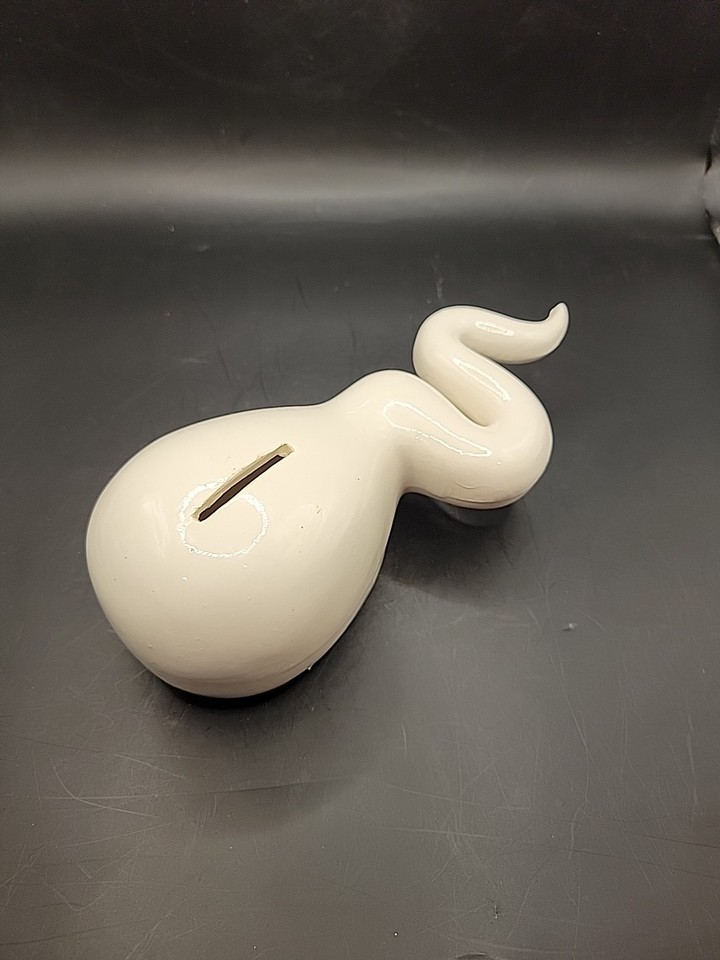 Vintage ceramic 'Sperm Bank' coin bank is peak kitschy adult humor — the kind of shelf piece that stops every guest in their tracks.