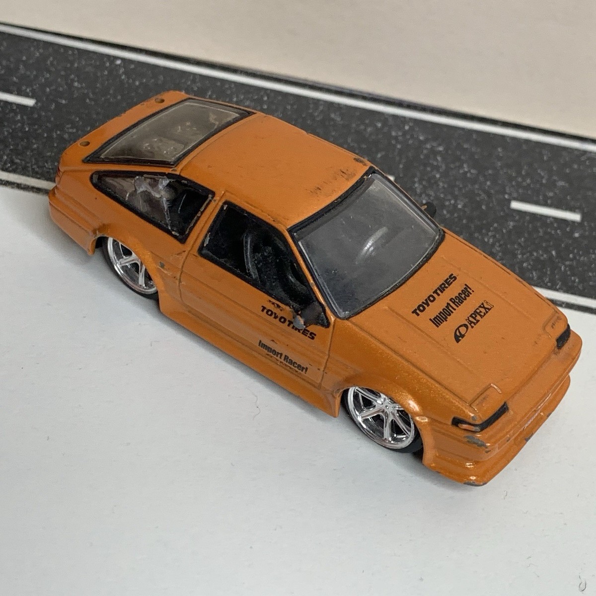 ミニカー Import Racer 1/24 Toyota Trueno AE86 Jada Toys Import Racer Toyota Corolla AE86 Trueno Hatch Orange 1