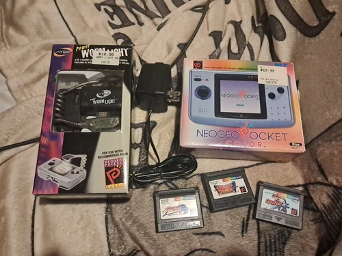 Neo geo pocket color & power worm light. with boxes, manual, charger, & 3 games