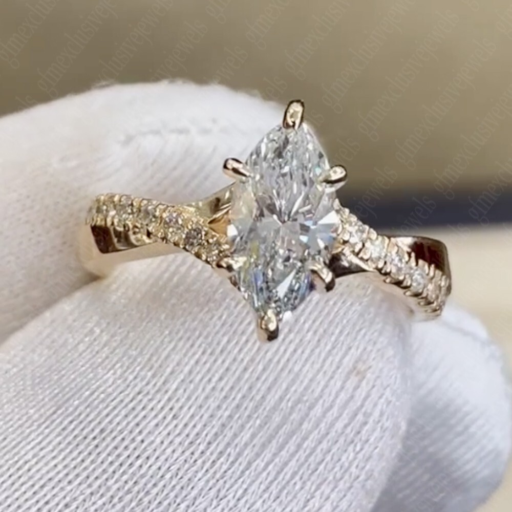 TCW Marquise Cut Moissanite Criss Cross Engagement Ring 14K Yellow Gold