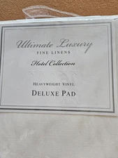 Ultimate Luxury Vinyl pad. Bed,Bath, and Beyond. Table 52" x 108" cover.N.I.P.