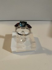 Sterling Silver London blue Topaz And Garnet Side Stones Ring. Size 8