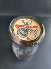 Half pint milk bottle with paper cap in vintage condition