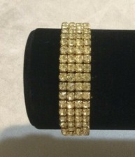 Gorgeous Girls Four Strand Champagne Rhinestone Stretch Bracelet Gold Tone