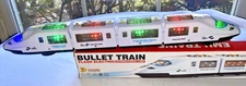 EMU CITY HIGH SPEED BULLET TRAIN BATTERY OP SOUNDS LIGHTS ROTATES + GOOD BOX