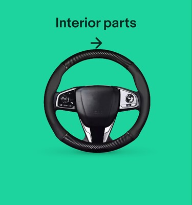A black steering wheel, linking to interior parts.
