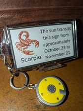 Birthday gift for a Scorpio: Zodiac keychain with mini flashlight!