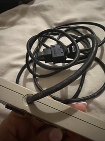 This image shows an original Nintendo Entertainment System (NES) controller