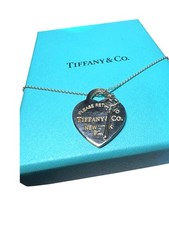 Tiffany  Co. Return to Tiffany  Heart Tag with Key Pendant in sterling silver.