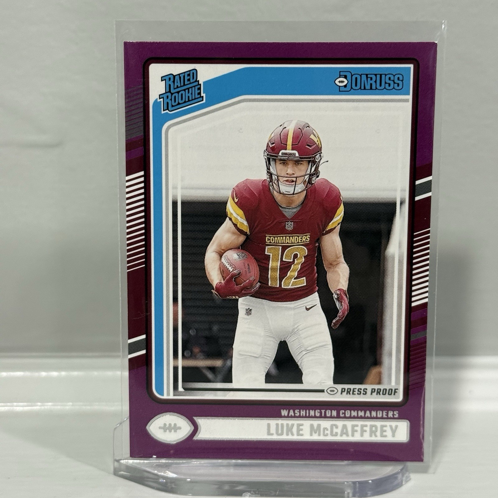 Luke McCaffrey 2024 Panini Donruss #302 Rated Rookie Press Proof Purple RC