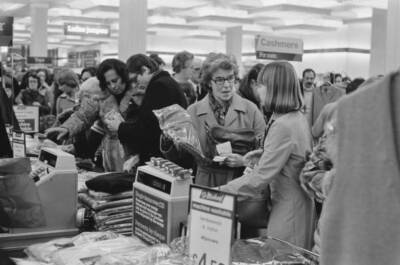 Shoppers at Marks and Spencer browsing through items UK 1976 OLD PHOTO