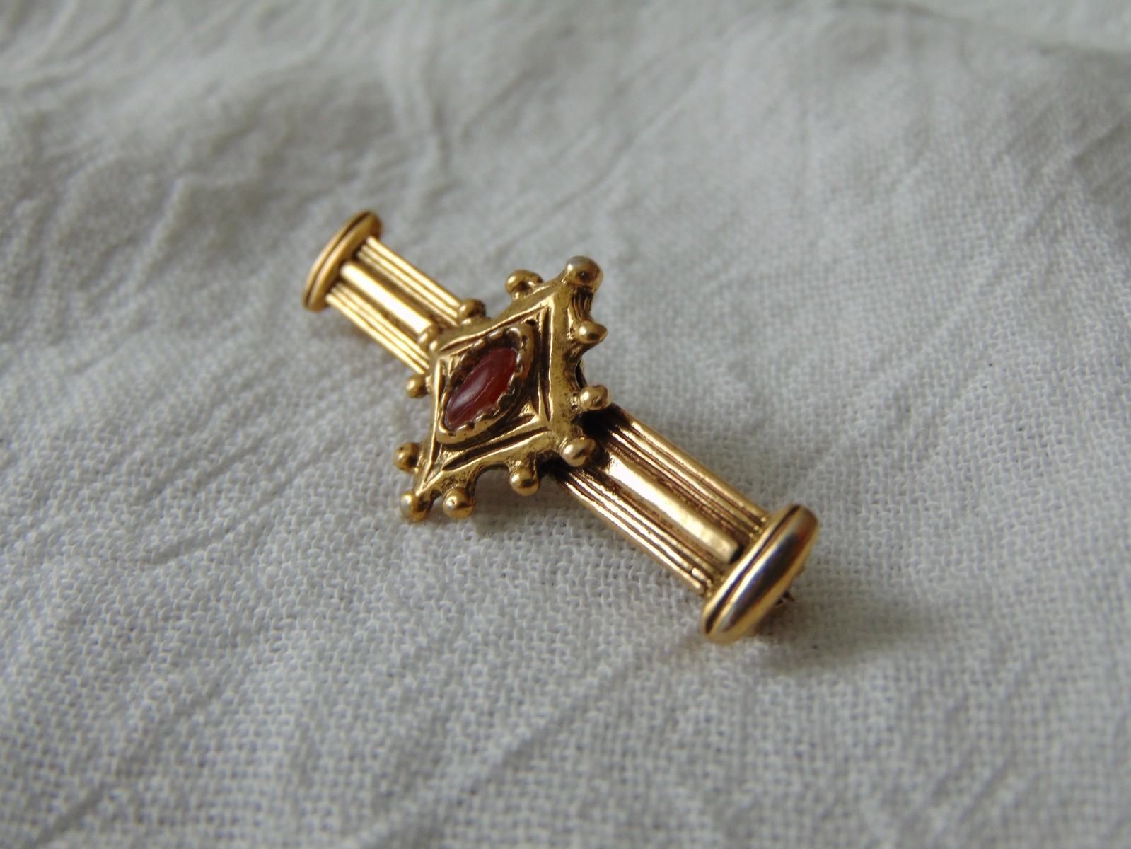 vintage gold plated bar pin with red navette stone