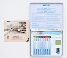 Pentel AQUASH Watercolor Crayons, Water Brush, Sponge, Sharpener in a Metal Tin