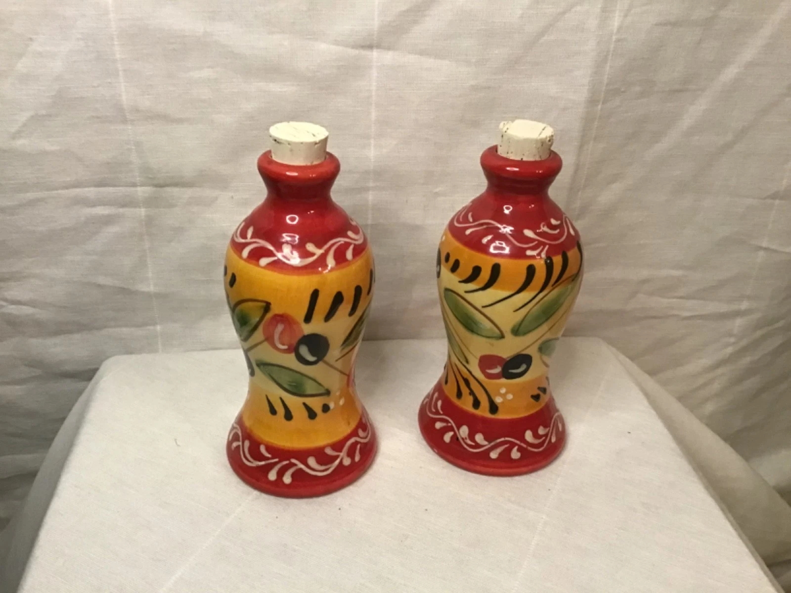 Pair of Ceramic Pier 1 Oil & Vinegar Bottles 7 7/8 H x 3 3/4 W. Made in Spain .