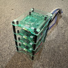 Four Raspberry Pi 4 Model B 8GB Devices in a Cluster Rig with a Netgear Switch