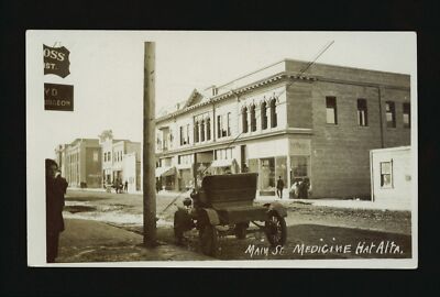 Main St Medicine Hat Alberta a commercial street in town with sto- Old Photo
