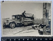 Old photo Young guys unload the car, nice men, interesting car