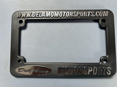 Del Amo Motorsports Motorcycle Dealership License Plate Frame. Plastic. New.