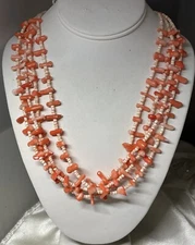 FINE 4-STRAND NECKLACE OF NATURAL SALMON CORAL AND HEISHI  WITH STERLING CLASP
